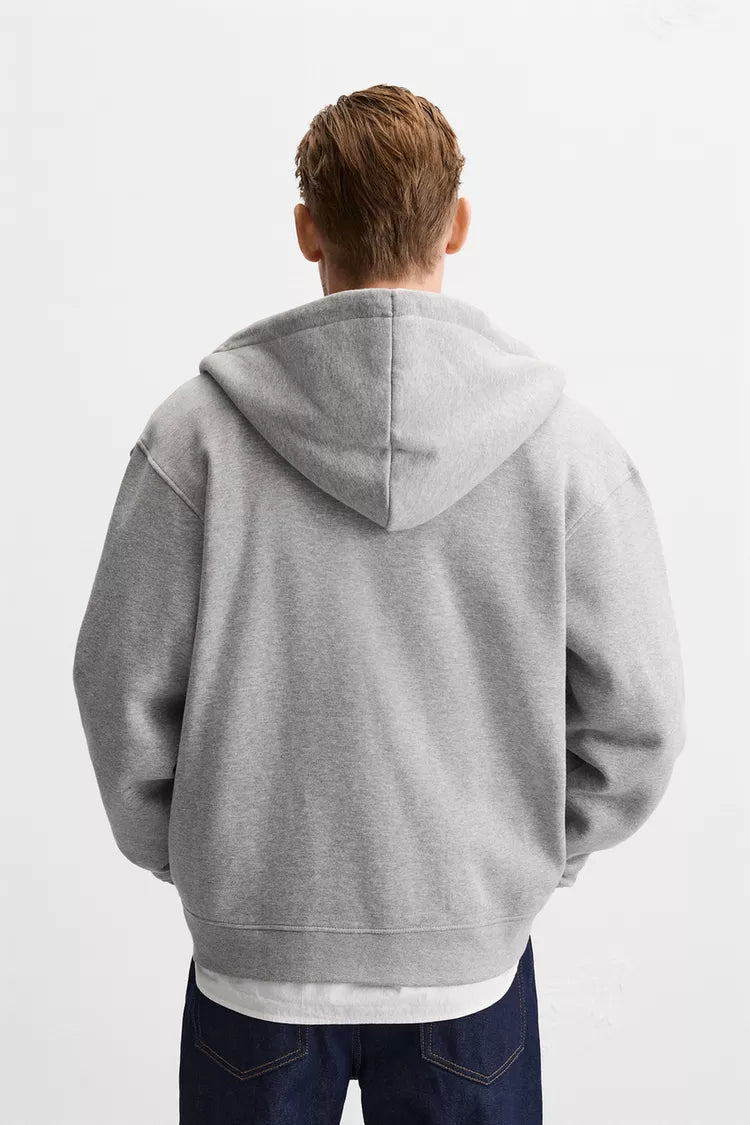 sudadera gris jaspeada